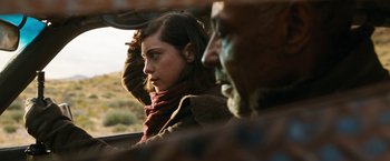 Movie still from “Maze Runner: The Death Cure” (2018), directed by Wes Ball – A woman sitting in the passenger seat of a car next to an older man; Close Up shot, Over the shoulder angle