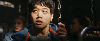 Movie still from “Maze Runner: The Death Cure” (2018), directed by Wes Ball – A young man holding a metal chain in his hand; Close Up shot, Low angle