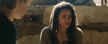 Movie still from “Maze Runner: The Death Cure” (2018), directed by Wes Ball – A woman with dreads is looking at the camera; Close Up shot, Over the shoulder angle