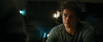 Movie still from “Maze Runner: The Death Cure” (2018), directed by Wes Ball – A person sitting in a room; Close Up shot, Over the shoulder angle