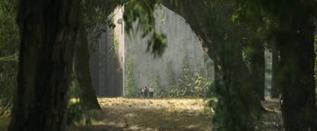 Movie still from “Maze Runner: The Death Cure” (2018), directed by Wes Ball – A group of people standing on top of a grass covered field; Extreme Wide shot, High angle