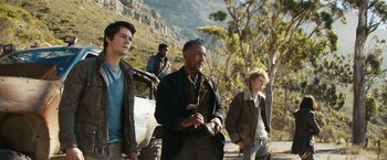 Movie still from “Maze Runner: The Death Cure” (2018), directed by Wes Ball – A group of men standing next to each other on top of a hill; Medium shot, Low angle