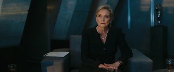 Movie still from “Maze Runner: The Death Cure” (2018), directed by Wes Ball – An older woman wearing a black suit and pearl necklace; Medium shot, Low angle