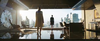 Movie still from “Maze Runner: The Death Cure” (2018), directed by Wes Ball – Two women are standing in front of a large window; Wide shot, Low angle