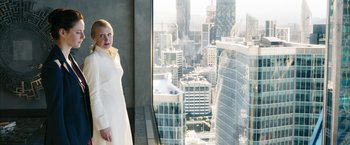 Movie still from “Maze Runner: The Death Cure” (2018), directed by Wes Ball – A woman standing in front of a window with a city view; Medium shot, Low angle