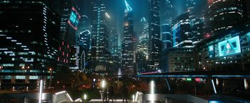 Movie still from “Maze Runner: The Death Cure” (2018), directed by Wes Ball – Two people are standing in front of a fountain in a city at night; Extreme Wide shot, High angle