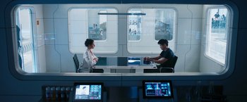Movie still from “Maze Runner: The Death Cure” (2018), directed by Wes Ball – A man and a woman sitting in front of computer screens; Wide shot, Over the shoulder angle