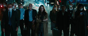 Movie still from “Maze Runner: The Death Cure” (2018), directed by Wes Ball – A group of people walking down a street at night; Medium shot, Over the shoulder angle
