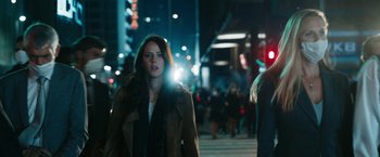 Movie still from “Maze Runner: The Death Cure” (2018), directed by Wes Ball – A woman is walking down the street at night; Medium shot, Low angle