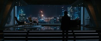 Movie still from “Maze Runner: The Death Cure” (2018), directed by Wes Ball – A man standing in front of a window at night; Extreme Wide shot, Over the shoulder angle