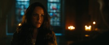 Movie still from “Maze Runner: The Death Cure” (2018), directed by Wes Ball – A woman is standing in front of a stained - glass window; Close Up shot, Low angle