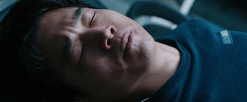 Movie still from “Maze Runner: The Death Cure” (2018), directed by Wes Ball – A person sleeping with his eyes closed; Close Up shot, Overhead angle