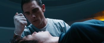 Movie still from “Maze Runner: The Death Cure” (2018), directed by Wes Ball – A man in a blue shirt is looking at another man; Close Up shot, Over the shoulder angle