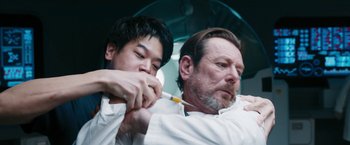 Movie still from “Maze Runner: The Death Cure” (2018), directed by Wes Ball – A man and a man with a toothbrush in his mouth; Close Up shot, Low angle