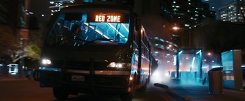 Movie still from “Maze Runner: The Death Cure” (2018), directed by Wes Ball – A bus driving down a street at night; Extreme Wide shot, Over the shoulder angle