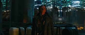 Movie still from “Maze Runner: The Death Cure” (2018), directed by Wes Ball – A man standing in the dark in front of a building; Medium shot, Low angle