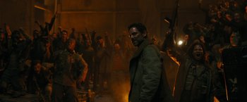 Movie still from “Maze Runner: The Death Cure” (2018), directed by Wes Ball – A group of people standing in a room with smoke coming out of them; Medium shot, Over the shoulder angle