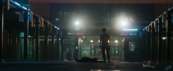 Movie still from “Maze Runner: The Death Cure” (2018), directed by Wes Ball – A man standing on the street in the dark; Wide shot, Low angle