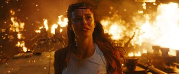 Movie still from “Maze Runner: The Death Cure” (2018), directed by Wes Ball – A person near a burning building; Close Up shot, Low angle