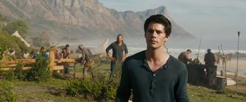 Movie still from “Maze Runner: The Death Cure” (2018), directed by Wes Ball – A man standing in front of two other men; Medium shot, Low angle