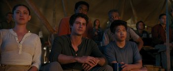 Movie still from “Maze Runner: The Death Cure” (2018), directed by Wes Ball – A group of young men sitting next to each other; Medium shot, Low angle