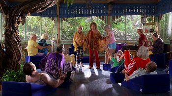 Movie still from “Meet the Fockers” (2004), directed by Jay Roach – A group of people sitting in a living room; Wide shot, High angle