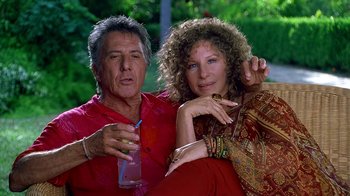 Movie still from “Meet the Fockers” (2004), directed by Jay Roach – An older man and a younger woman sitting next to each other; Medium shot, Low angle