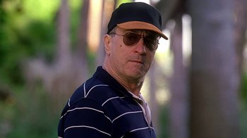 Movie still from “Meet the Fockers” (2004), directed by Jay Roach – A person wearing sunglasses and a hat; Close Up shot, Low angle