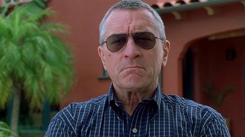 Movie still from “Meet the Fockers” (2004), directed by Jay Roach – An older man wearing sunglasses and a plaid shirt; Close Up shot, Low angle