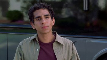 Movie still from “Meet the Fockers” (2004), directed by Jay Roach – A young man in a brown shirt and a brown jacket; Close Up shot, High angle