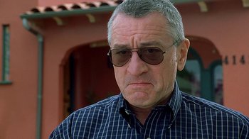 Movie still from “Meet the Fockers” (2004), directed by Jay Roach – An older man wearing sunglasses and a plaid shirt; Close Up shot, Low angle