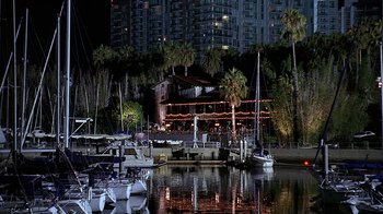 Movie still from “Meet the Fockers” (2004), directed by Jay Roach – Many boats in the water at night time; Extreme Wide shot, High angle