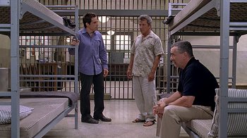 Movie still from “Meet the Fockers” (2004), directed by Jay Roach – A group of men standing next to each other in a room; Wide shot, Low angle