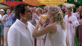 Movie still from “Meet the Fockers” (2004), directed by Jay Roach – A man and a woman are drinking from champagne flutes at an event; Medium shot, Over the shoulder angle