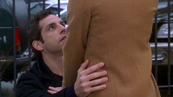 Movie still from “Meet the Parents” (2000), directed by Jay Roach – A person hugging another person; Medium shot, Over the shoulder angle
