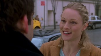 Movie still from “Meet the Parents” (2000), directed by Jay Roach – A woman smiles at a man on the street; Close Up shot, Over the shoulder angle