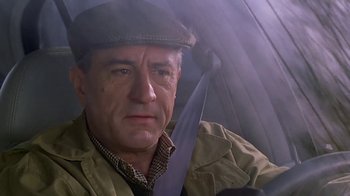 Movie still from “Meet the Parents” (2000), directed by Jay Roach – A person holding an open umbrella; Close Up shot, Over the shoulder angle