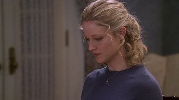 Movie still from “Meet the Parents” (2000), directed by Jay Roach – A woman with blonde hair is looking down at her face; Close Up shot, Over the shoulder angle