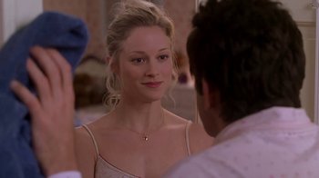 Movie still from “Meet the Parents” (2000), directed by Jay Roach – A woman in a white top looking at a man in a white shirt; Close Up shot, Over the shoulder angle