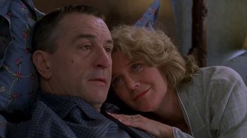 Movie still from “Meet the Parents” (2000), directed by Jay Roach – A man and a woman pose for a picture; Close Up shot, Low angle