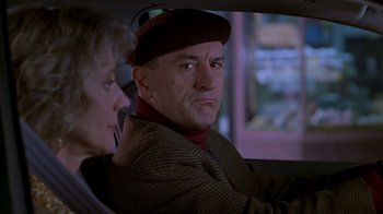 Movie still from “Meet the Parents” (2000), directed by Jay Roach – A man and a woman sitting in the back of a car; Close Up shot, Over the shoulder angle