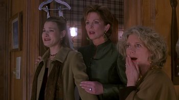 Movie still from “Meet the Parents” (2000), directed by Jay Roach – A group of women standing next to each other in a room; Medium shot, Over the shoulder angle