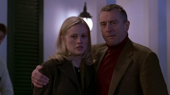Movie still from “Meet the Parents” (2000), directed by Jay Roach – A man and a woman standing next to each other; Medium shot, Low angle