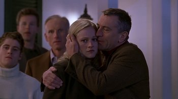 Movie still from “Meet the Parents” (2000), directed by Jay Roach – A man and a woman hugging each other; Close Up shot, Over the shoulder angle