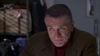 Movie still from “Meet the Parents” (2000), directed by Jay Roach – A person wearing a jacket; Close Up shot, Over the shoulder angle