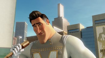 Movie still from “Megamind” (2010), directed by Tom McGrath – A man with a gun in his hand and a building in the background; Close Up shot, Low angle