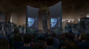 Movie still from “Megamind” (2010), directed by Tom McGrath – A crowd of people sitting in front of a screen; Extreme Wide shot, High angle