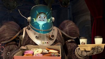 Movie still from “Megamind” (2010), directed by Tom McGrath – An image of a person in a spacesuit holding a box of donuts; Medium shot, Over the shoulder angle