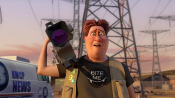 Movie still from “Megamind” (2010), directed by Tom McGrath – An animated man holding a camera in front of some power lines; Medium shot, Over the shoulder angle