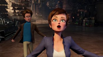 Movie still from “Megamind” (2010), directed by Tom McGrath – An animated woman and a man in the background; Medium shot, Over the shoulder angle